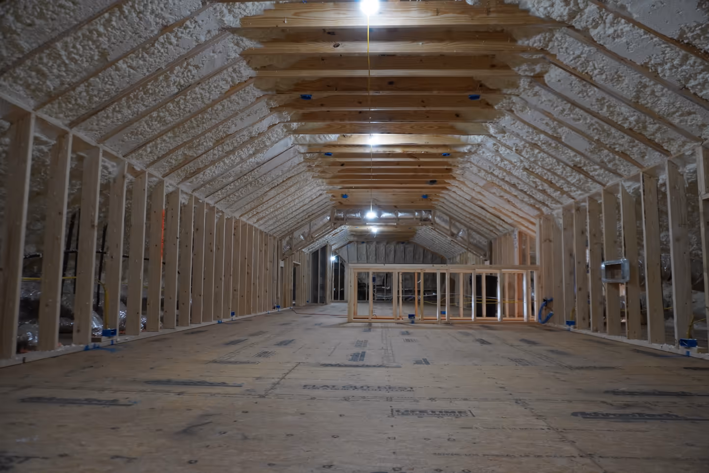 Spray foam installed through the center section of an attic framing run.