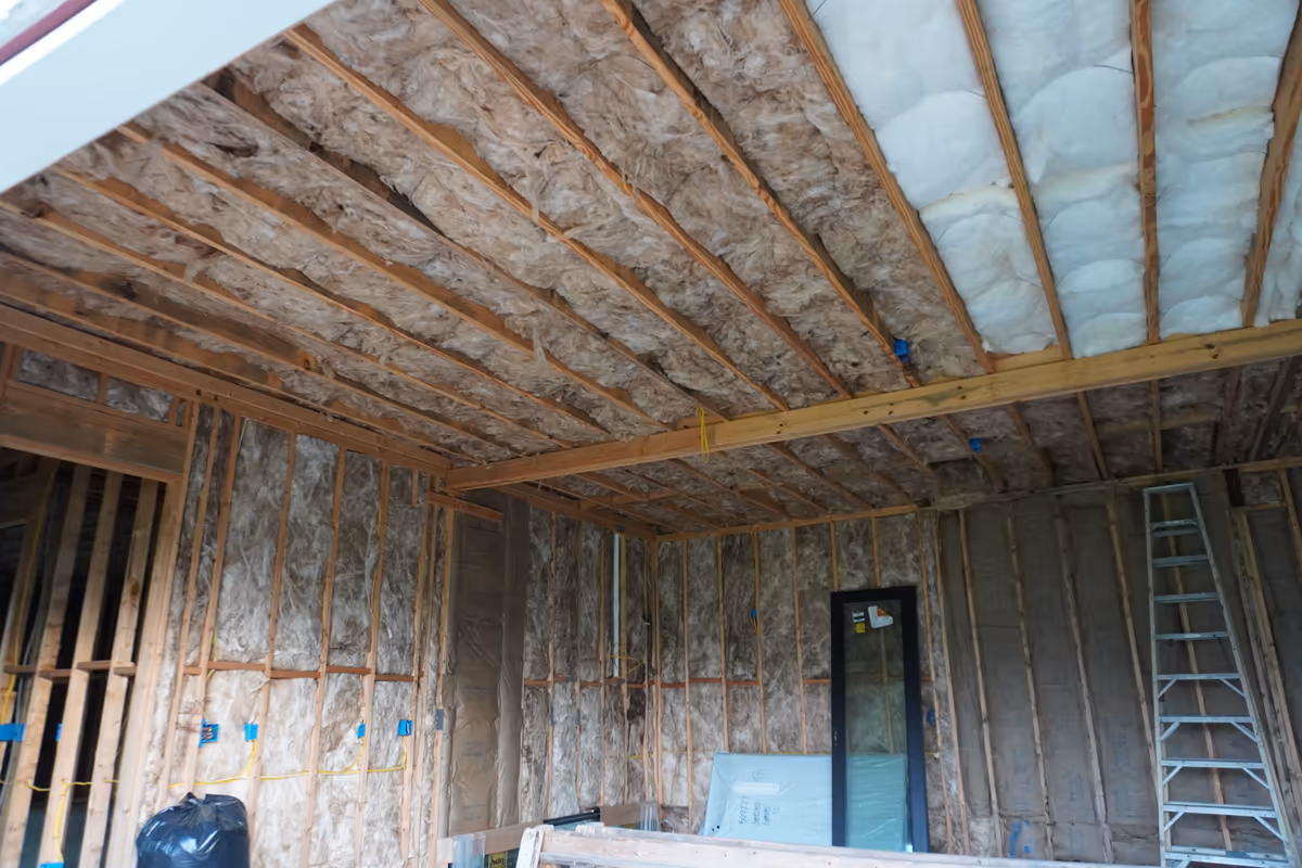 Third ceiling view of a mixed fiberglass and spray foam installation.