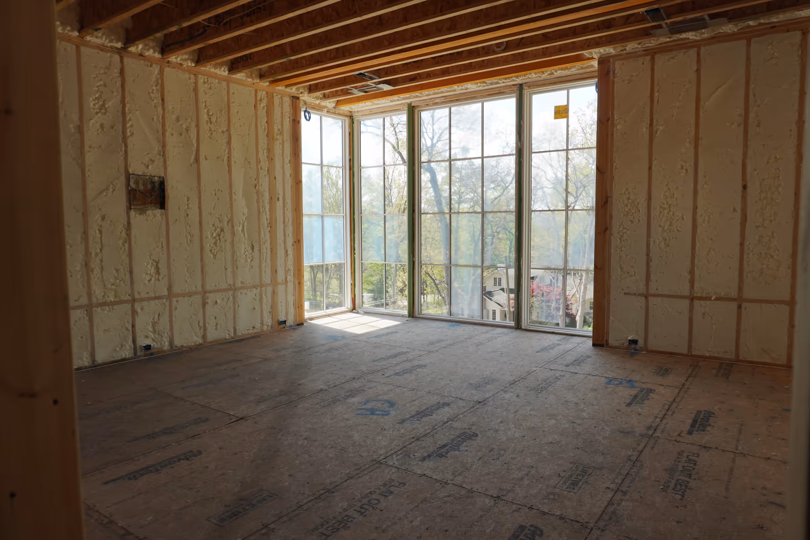 Spray foam installed through a sunroom framing assembly.