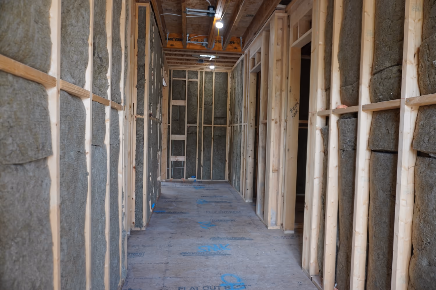 Rockwool insulation installed through a framed hallway.